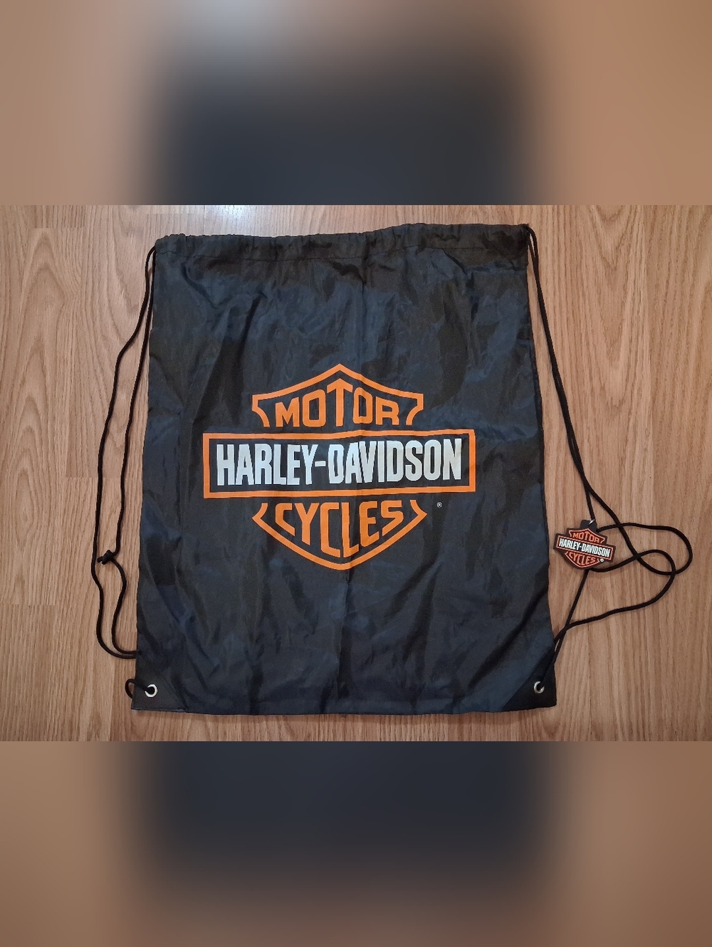 HARLEY DAVIDSON Drawstring Backpack with Orange Shield Logo.
